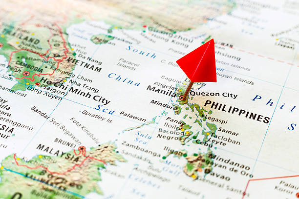 World map with pin on capital city of Philippines – Manila.
